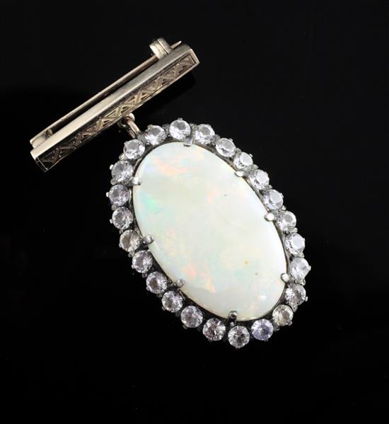 An early 20th century gold, white opal and white sapphire set oval pendant, with bar brooch attachment,